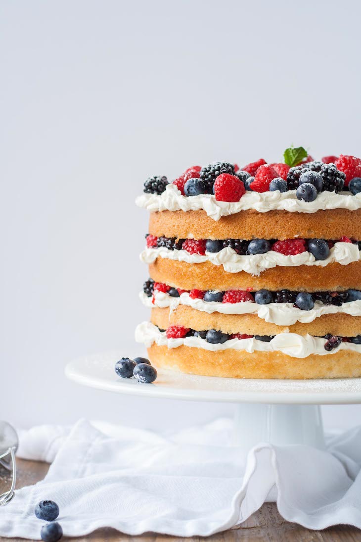 Cake on a white cake stand.