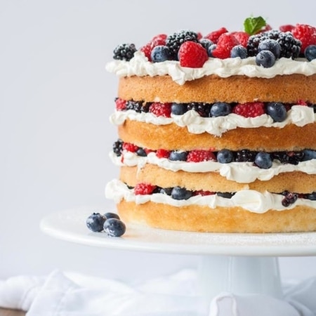 Cake on a white cake stand.