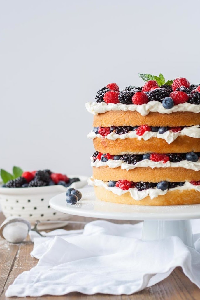 Cake on a white cake stand.