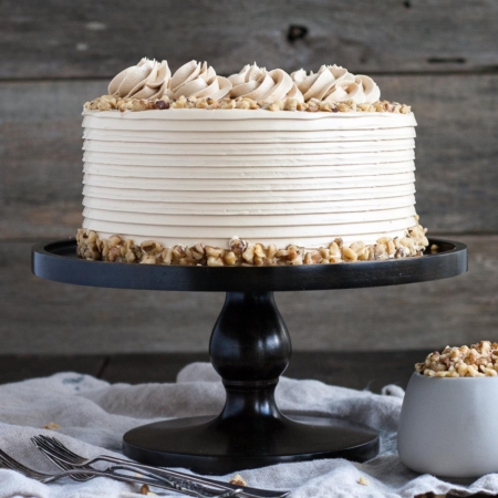 Cake on a dark cake stand.